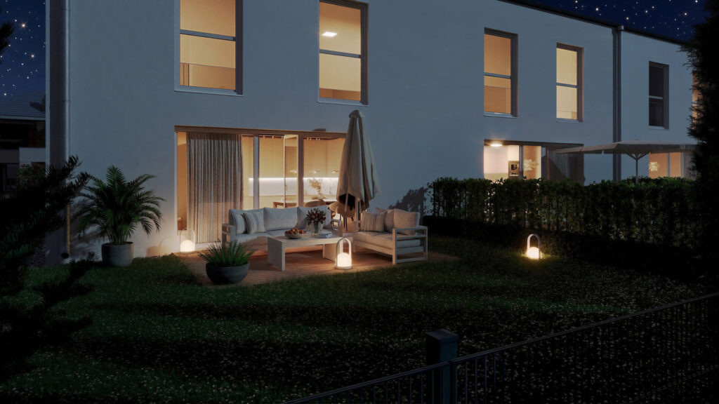 Nachtansicht eines Gartens mit Terrasse beim Wohnprojekt Reihenweise Grün in Klagenfurt