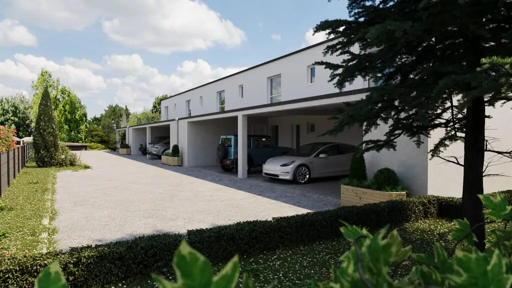 Straßenansicht des Wohnprojekts Reihenweise Grün mit überdachten Carports und begrüntem Zufahrtsbereich