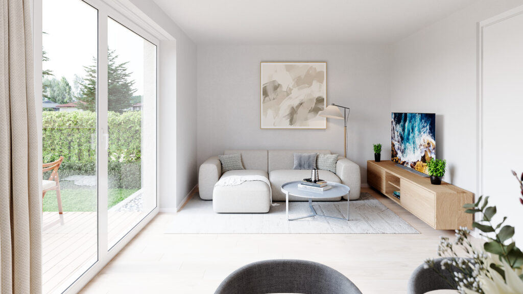Helles Wohnzimmer mit Sofa, TV-Bereich und direktem Zugang zur Terrasse im Wohnprojekt Reihenweise Grün